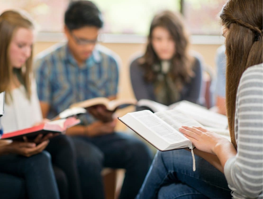 Young adults study Scripture together in a focused and welcoming group